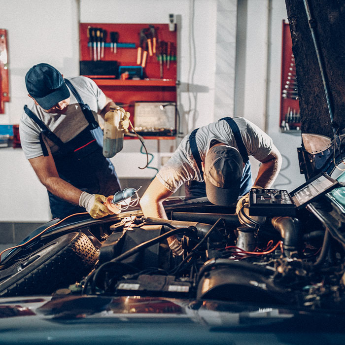 Two man working on car repair