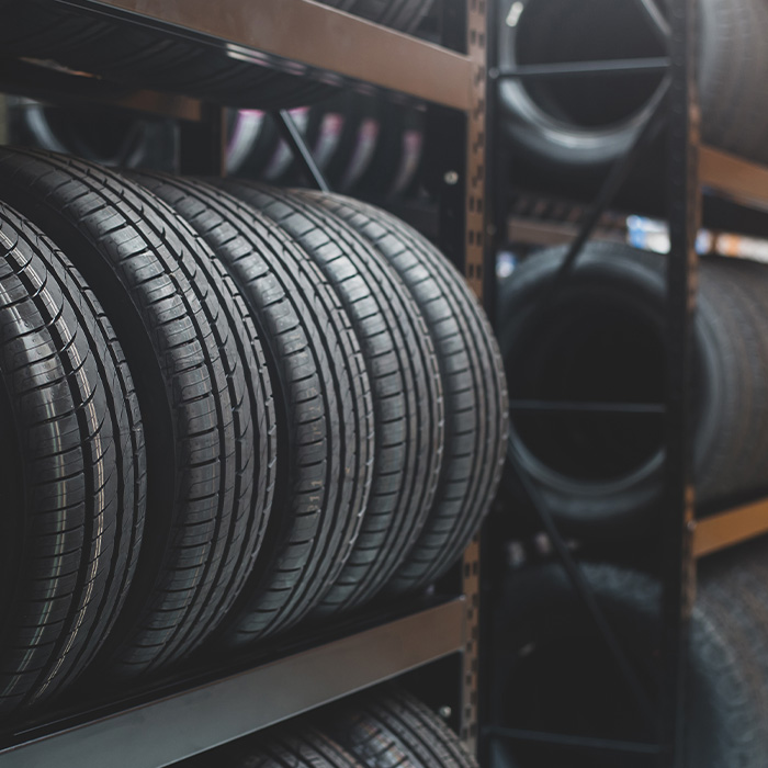 A new tire is placed on the tire storage rack in the tire factory