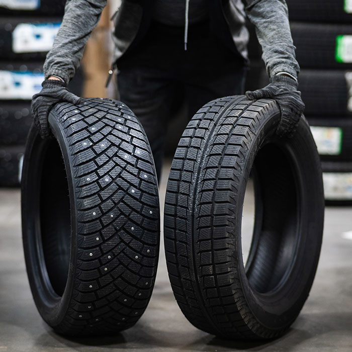 Mechanic keeps new summer and winter car tires in the garage